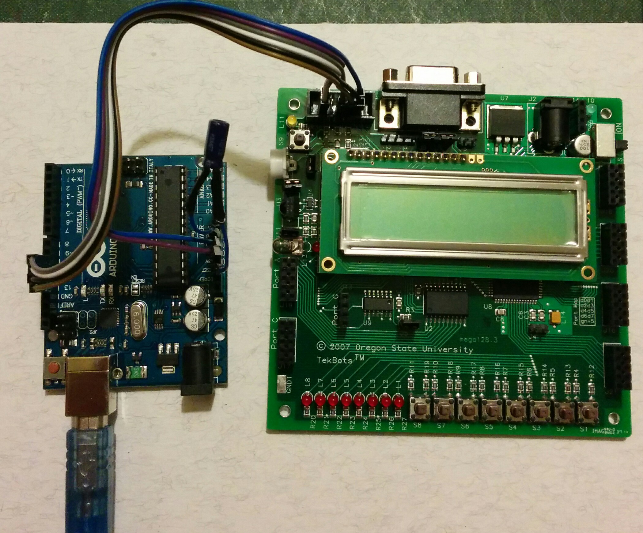 Arduino Uno wired to ATmega128 development board